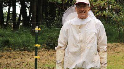 Bob Kloss in bee jacket, smiling